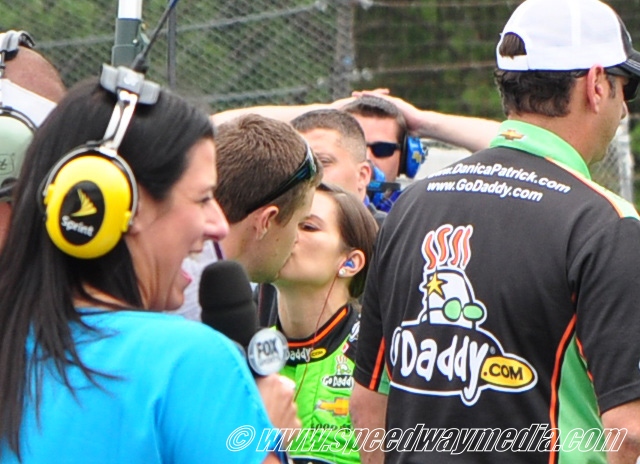 Danica and Ricky stealing a kiss.jpg